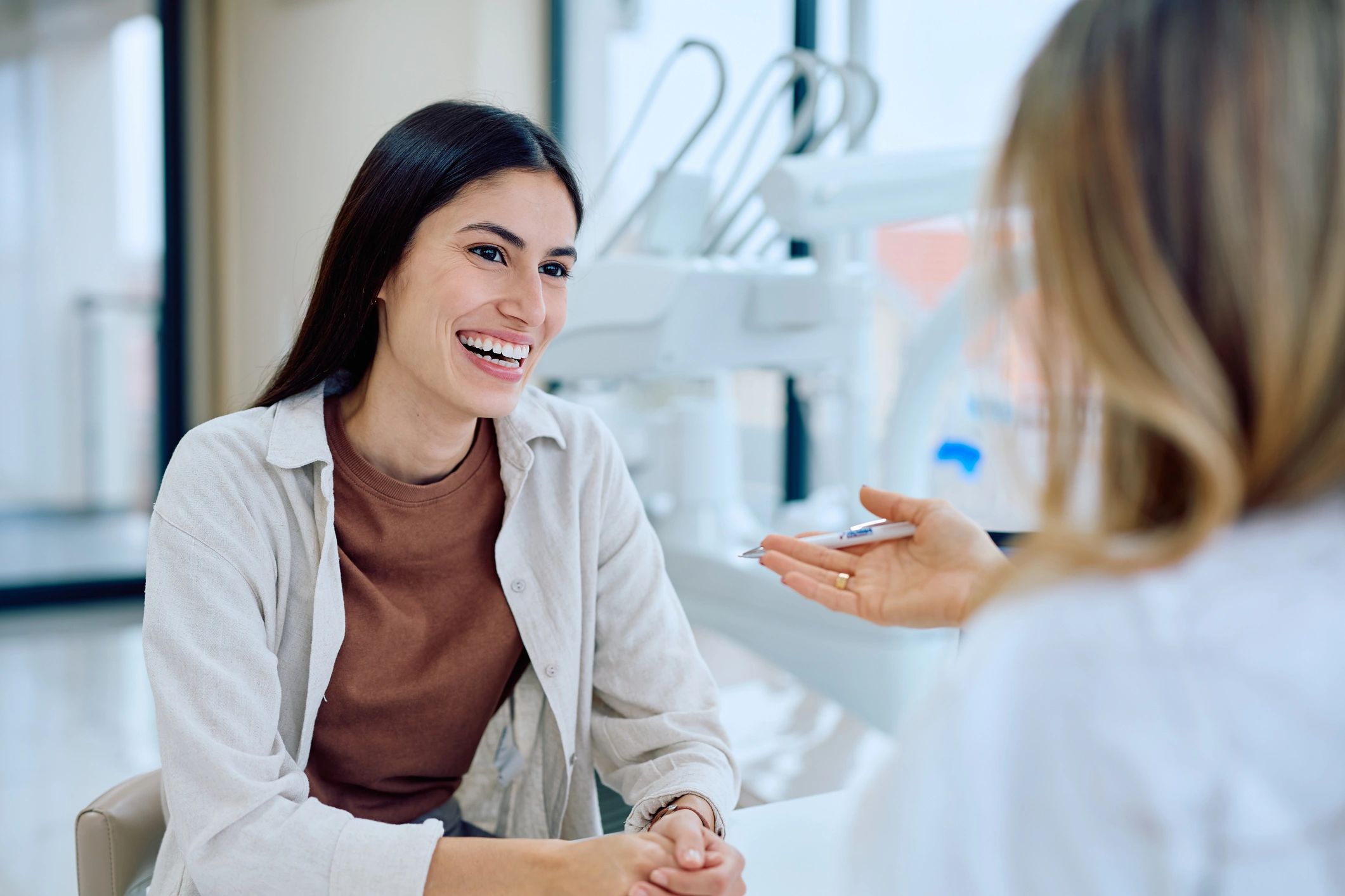 Patient consulting with a dentist in a modern clinic